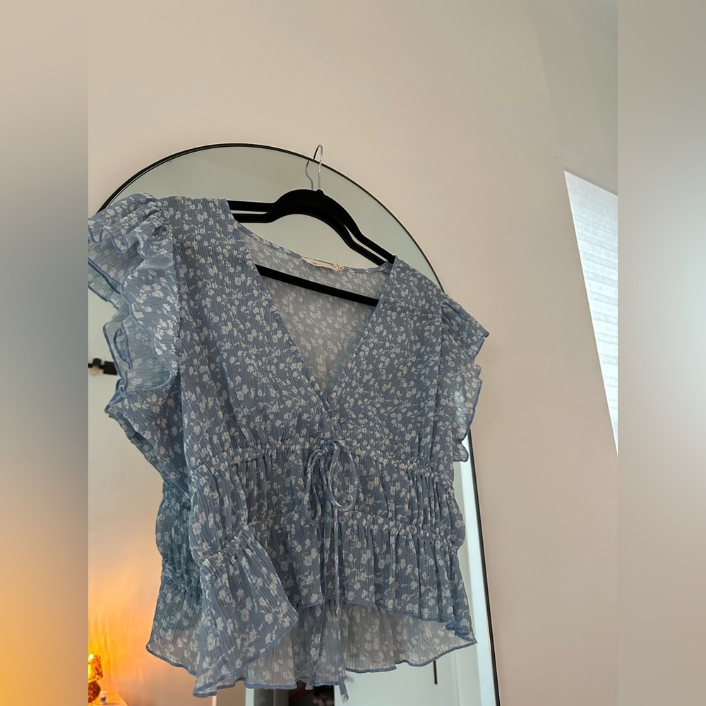 Blue floral peplum flutter sleeve top